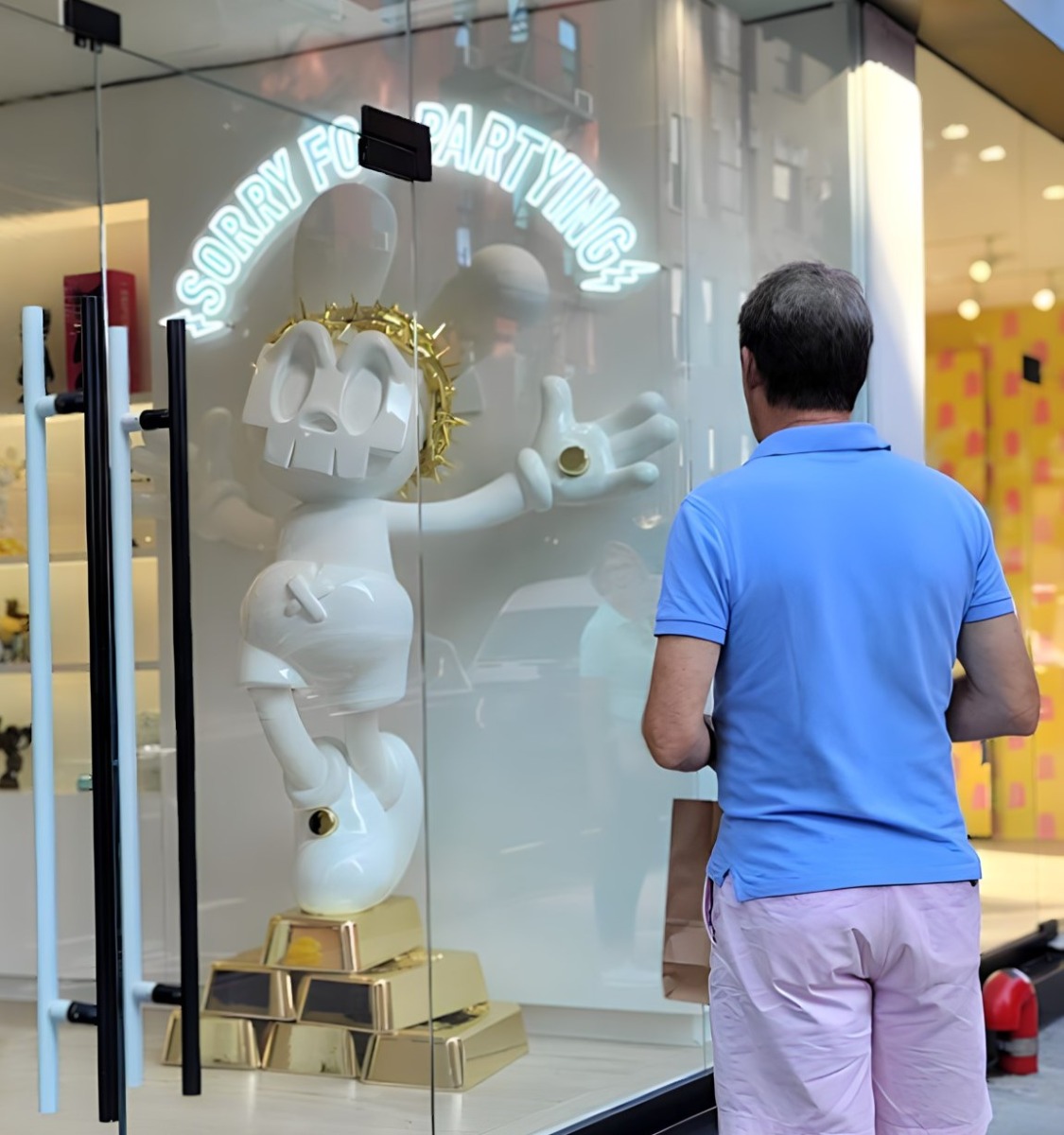 Custom Neon® white Sorry for Partying in-store signage near the window @superplastic