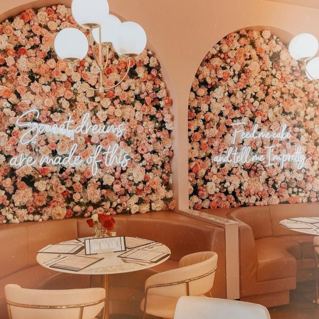White Custom Neon® quote signson floral walls @plateddreamscafe