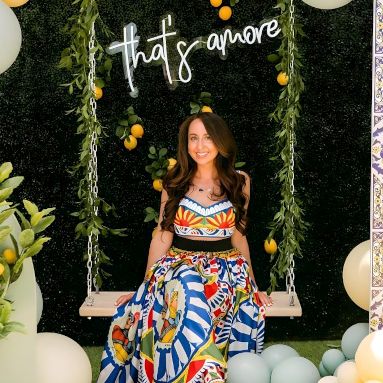 That's Amore white Custom Neon® on a grasswall behind a selfie swing surrounded by a white balloon waterfall at a garden party with props by @decorandfiesta