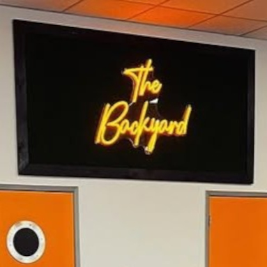 Custom Neon® yellow bahmi sign in the window @singhs_sa