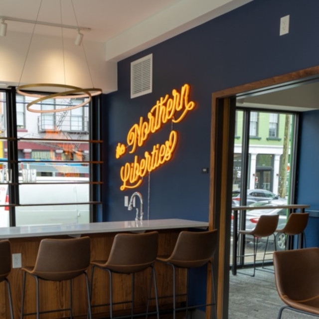 Orange Custom Neon® Cincinnati workspace sign @cohatch