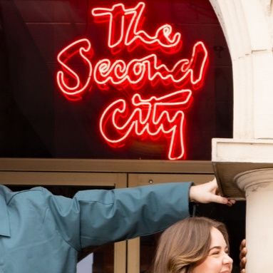 The Second City red Custom Neon® sign above the theatre entrance in Old Town Chicago