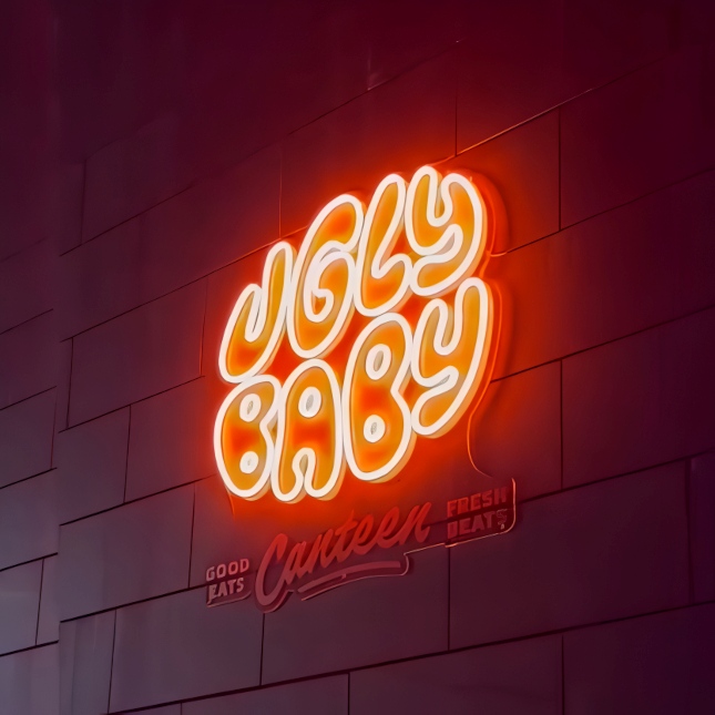 Custom Neon® logo sign in orange LED neon with UV print text below @uglybabyperth