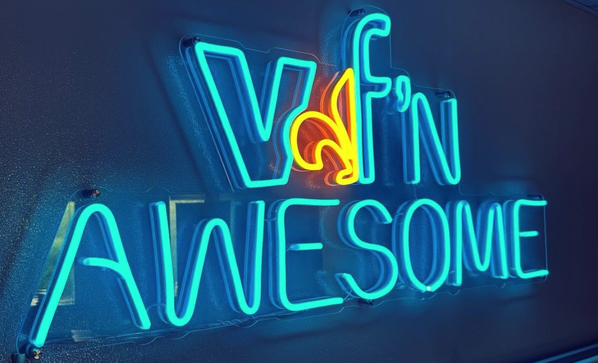 Blue and yellow Custom Neon® office sign reading vf'n awesome @victorianfinance