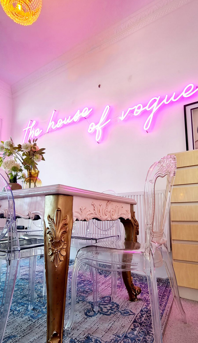 Pink Custom Neon® The House of Vogue sign for airbnb listing