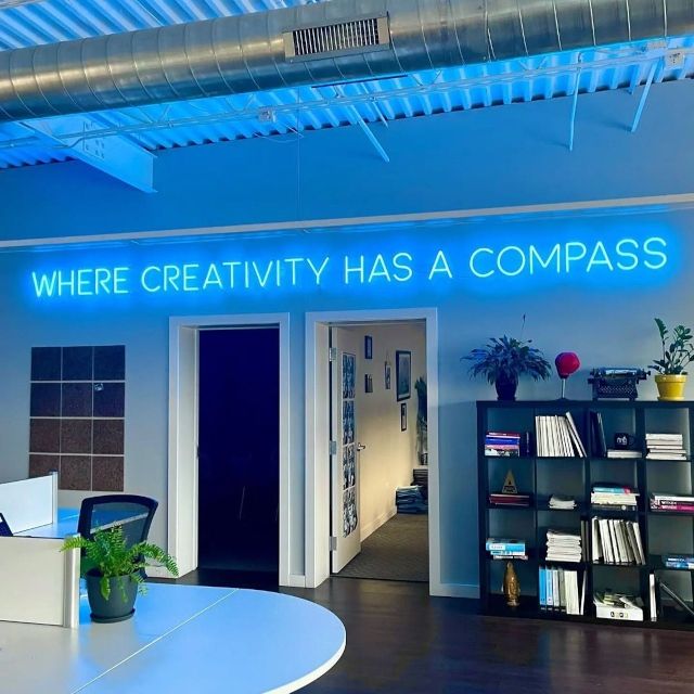 Where Creativity Has a Compass Custom Neon® sign in the Maclyn Group office in Chicago