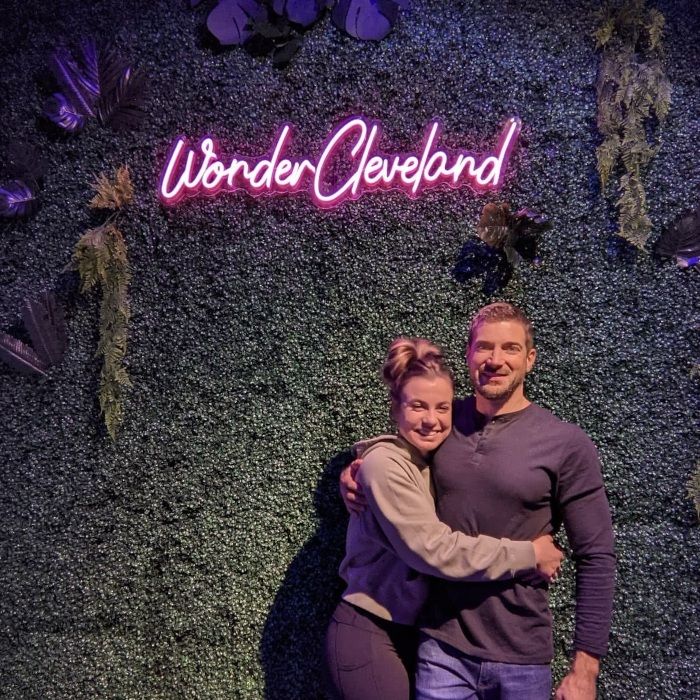 Pink neon sign by Custom Neon® on grass wall @wondercleveland