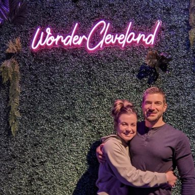 Pink neon sign by Custom Neon® on grass wall @wondercleveland